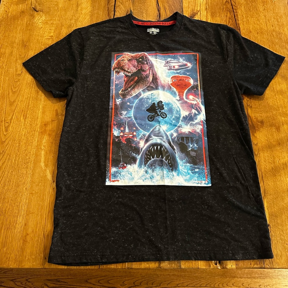 Universal Studios Tee featuring Jurassic Park, E.T., Jaws, Back to the Future